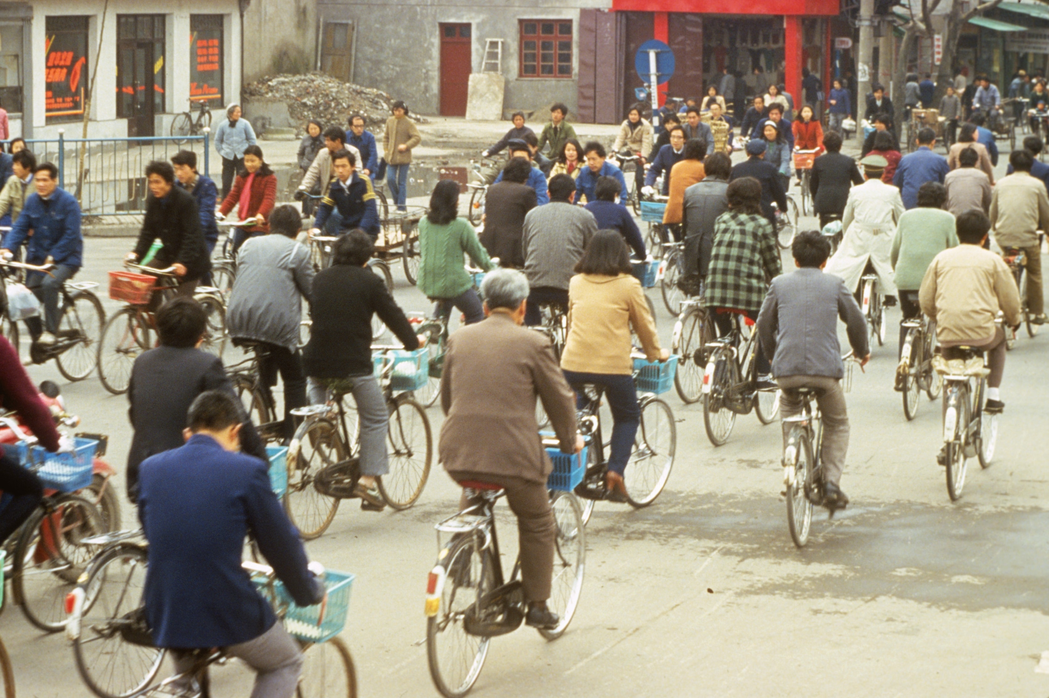 Busy street intersection filled with cyclists, China