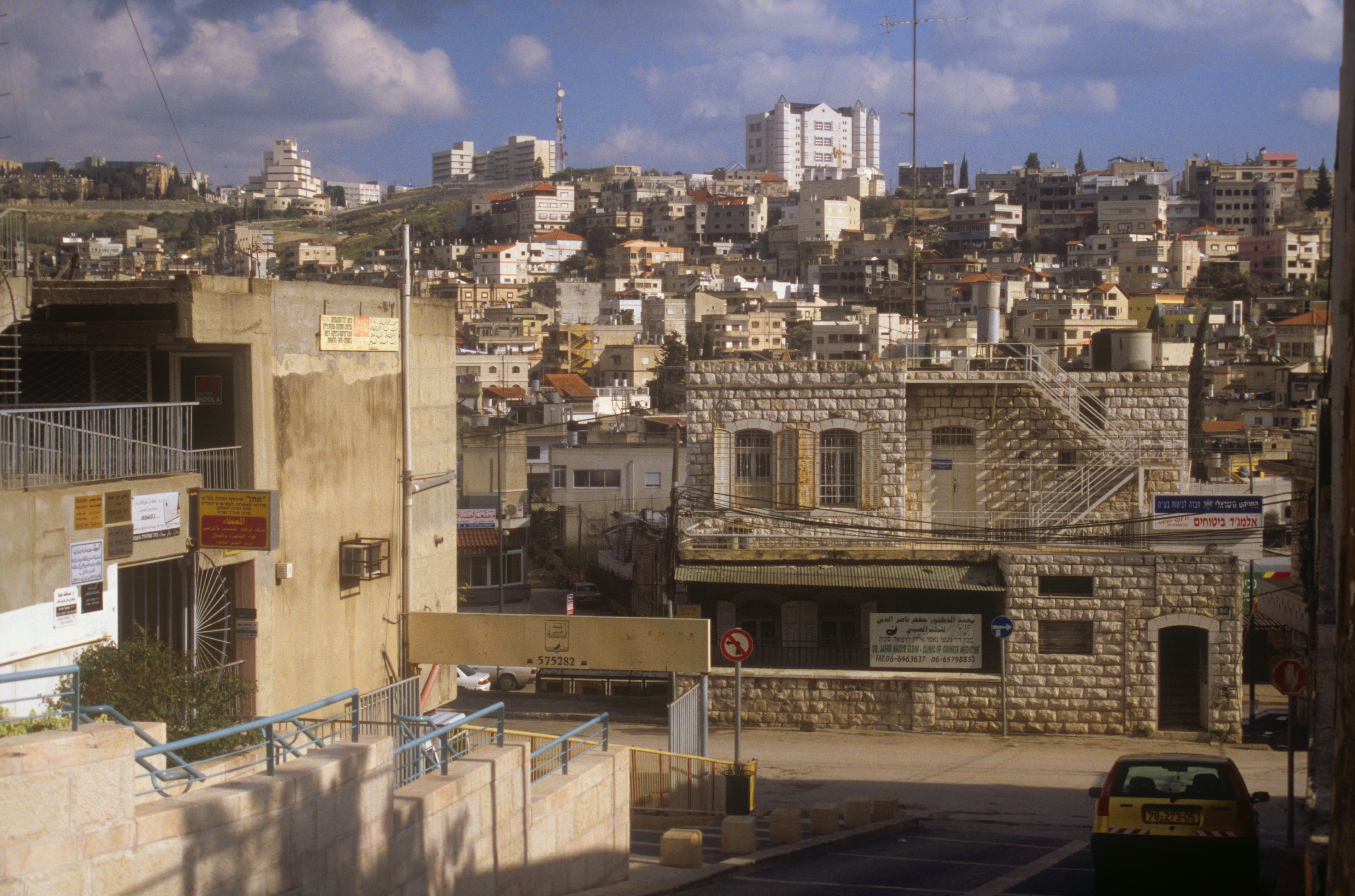 Hillside city street view with stone buildings in the Holy Land