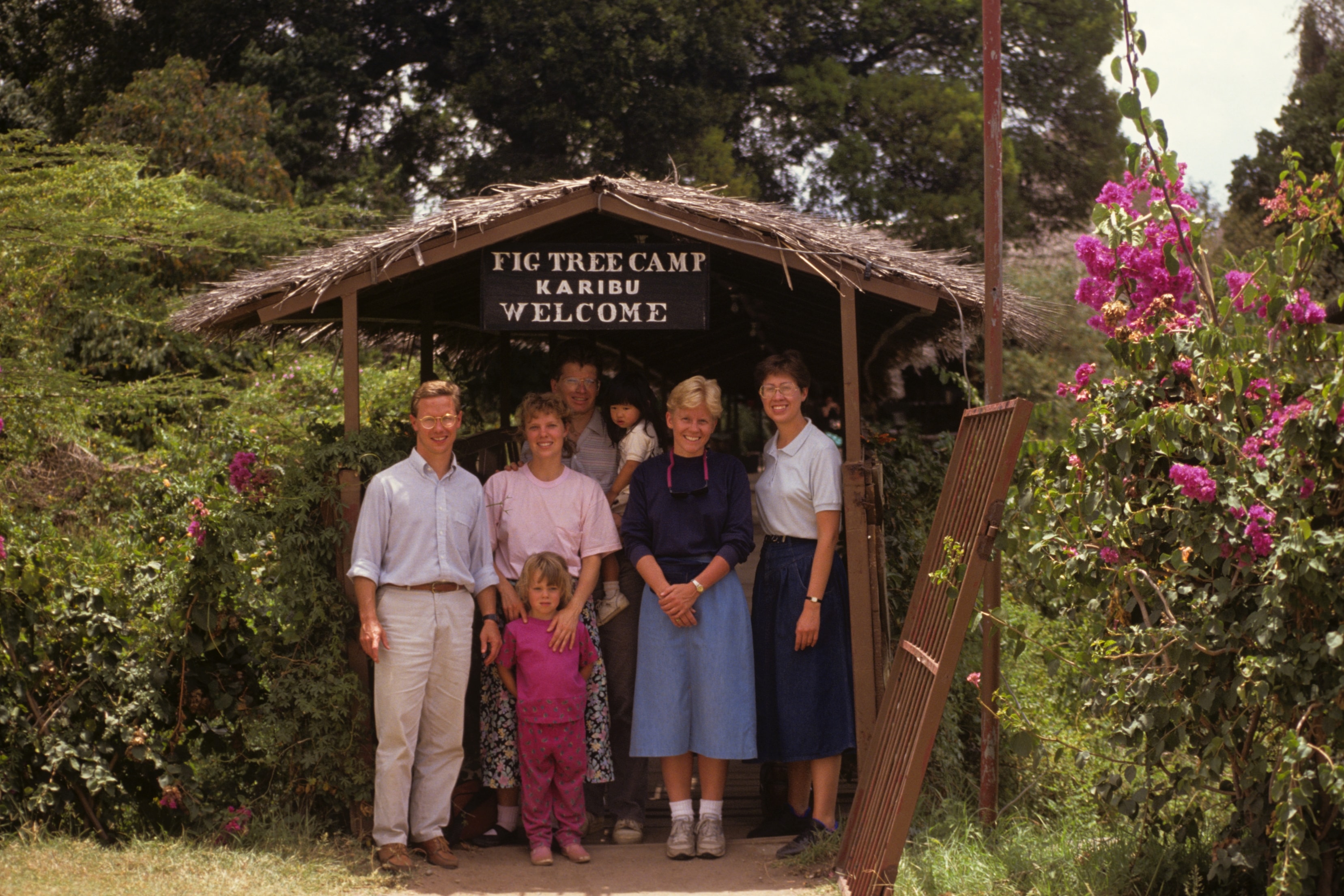 Group of visitors at Fig Tree Camp Karibu Welcome entrance in Kenya