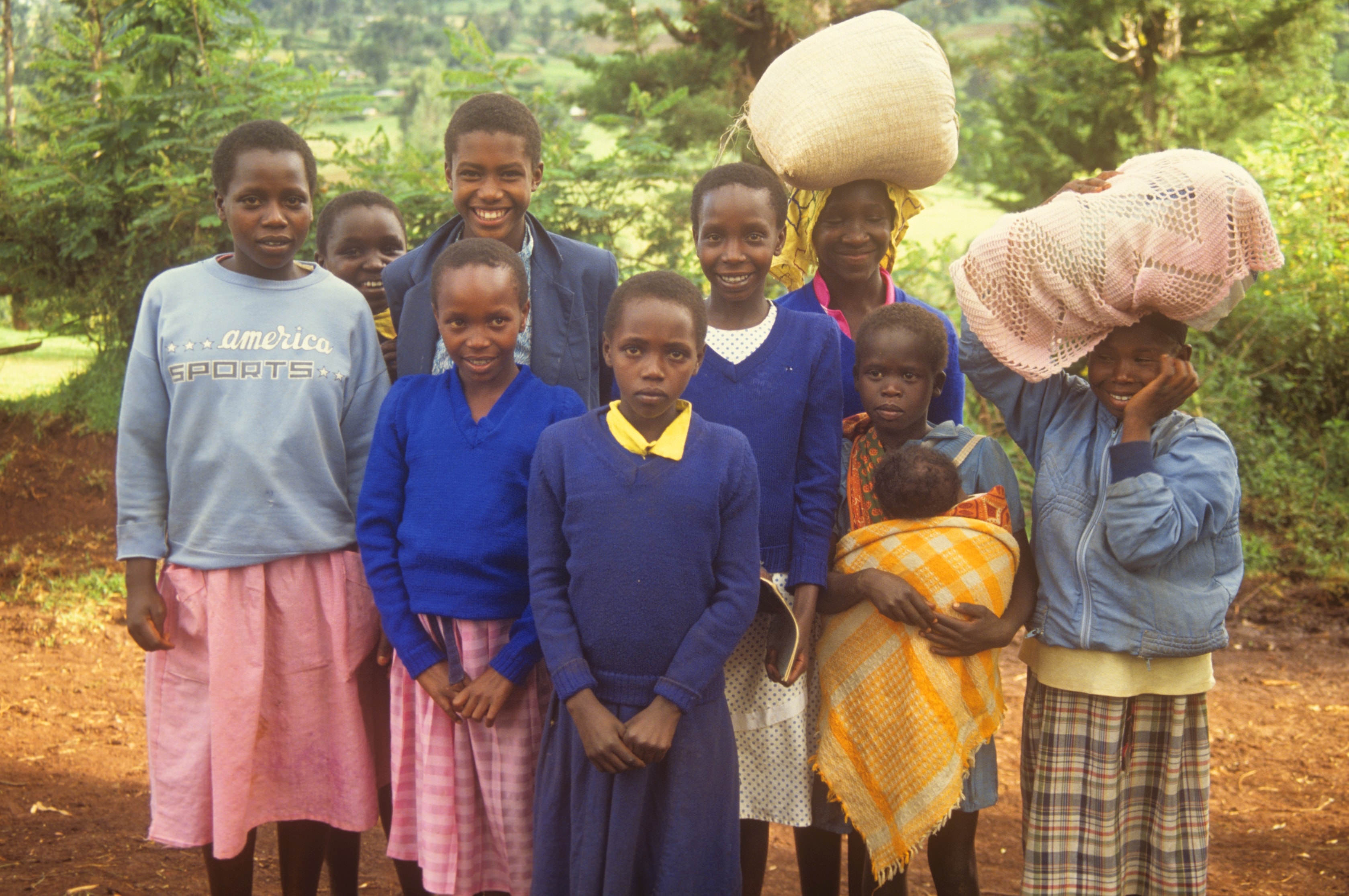 Group of girls and women on a dirt road in rural Kenya