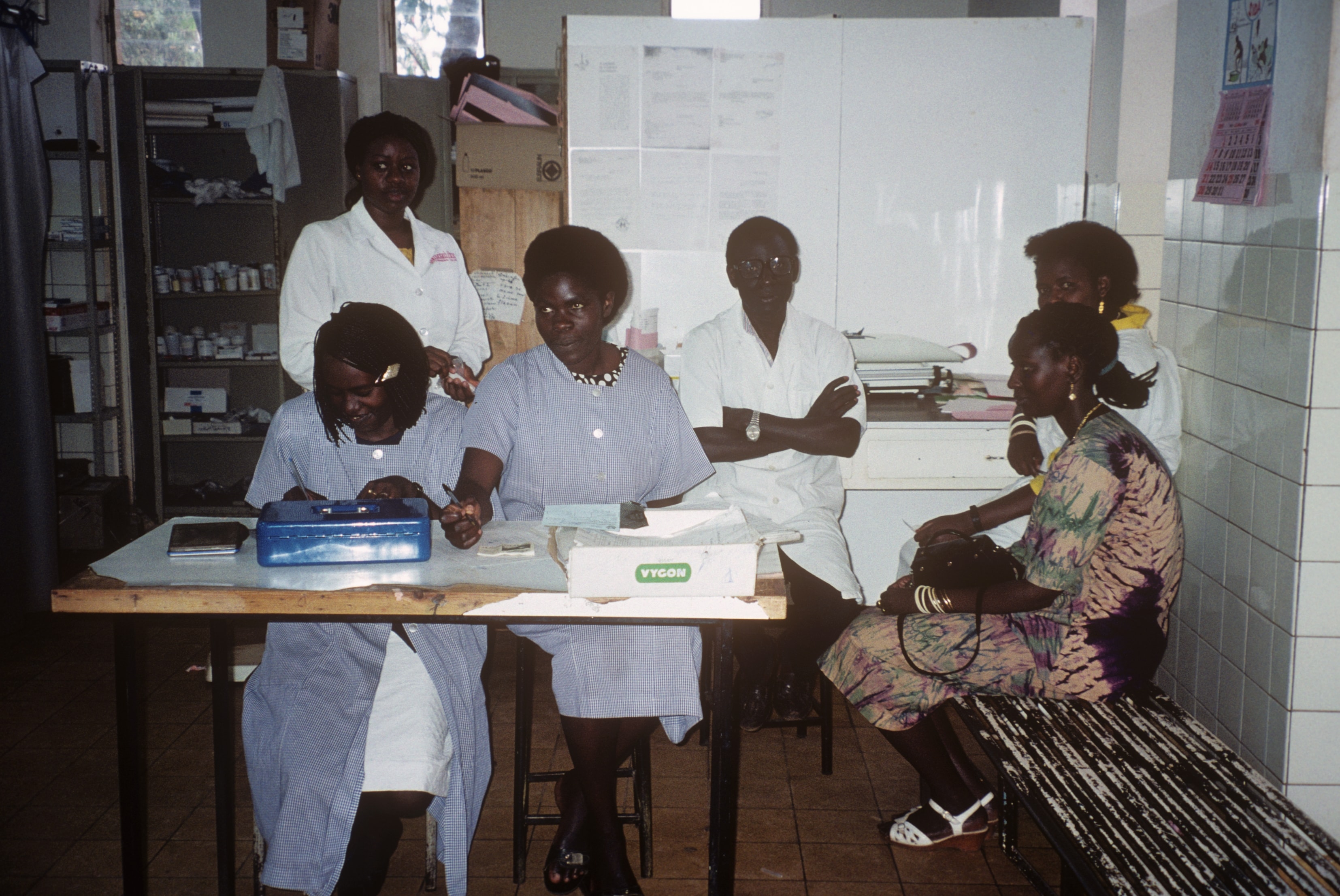 Clinic staff and a patient at a medical facility in Rwanda