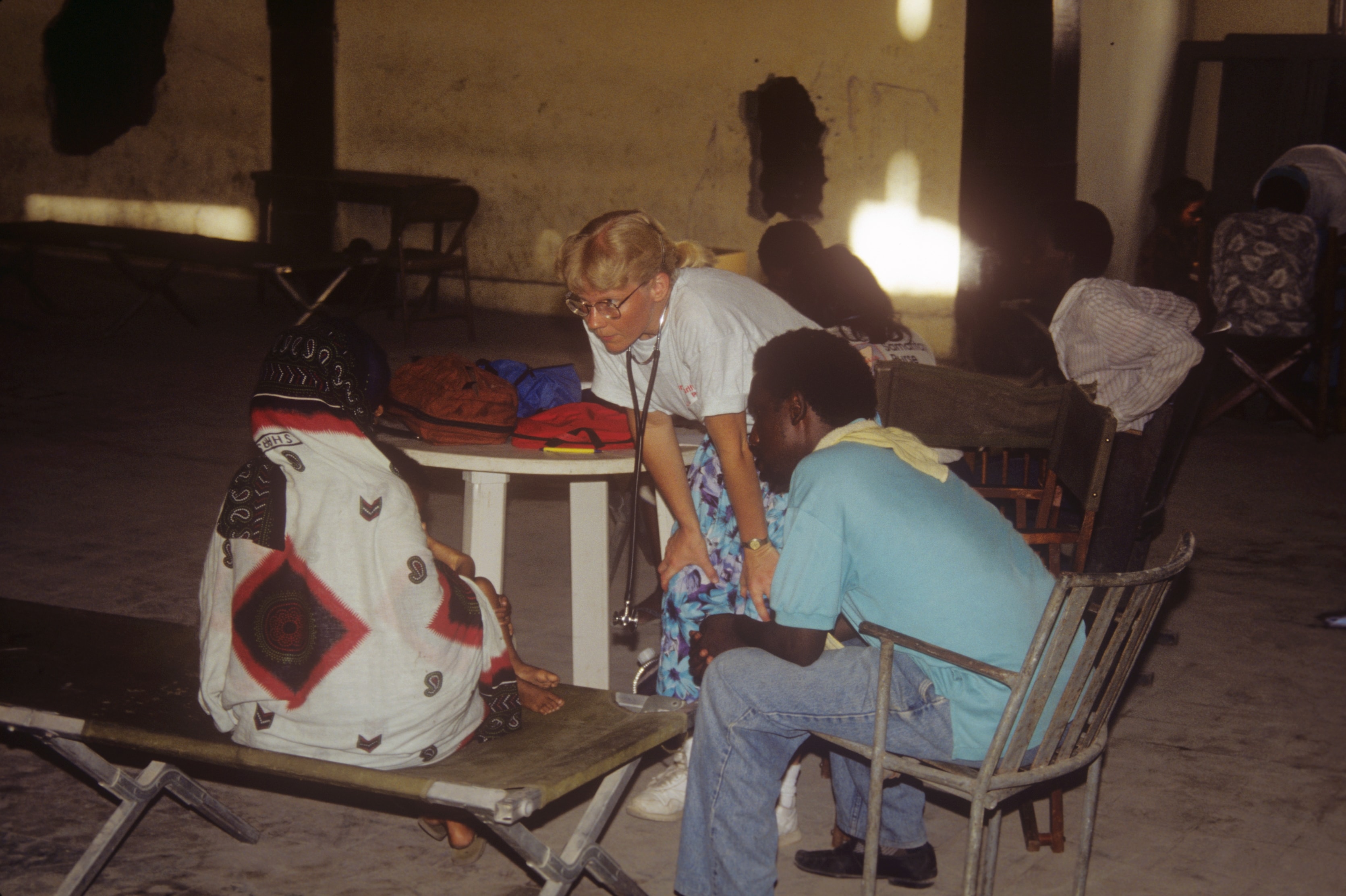 Dr. Susan Vitalis seeing patients at an outdoor clinic in Somalia
