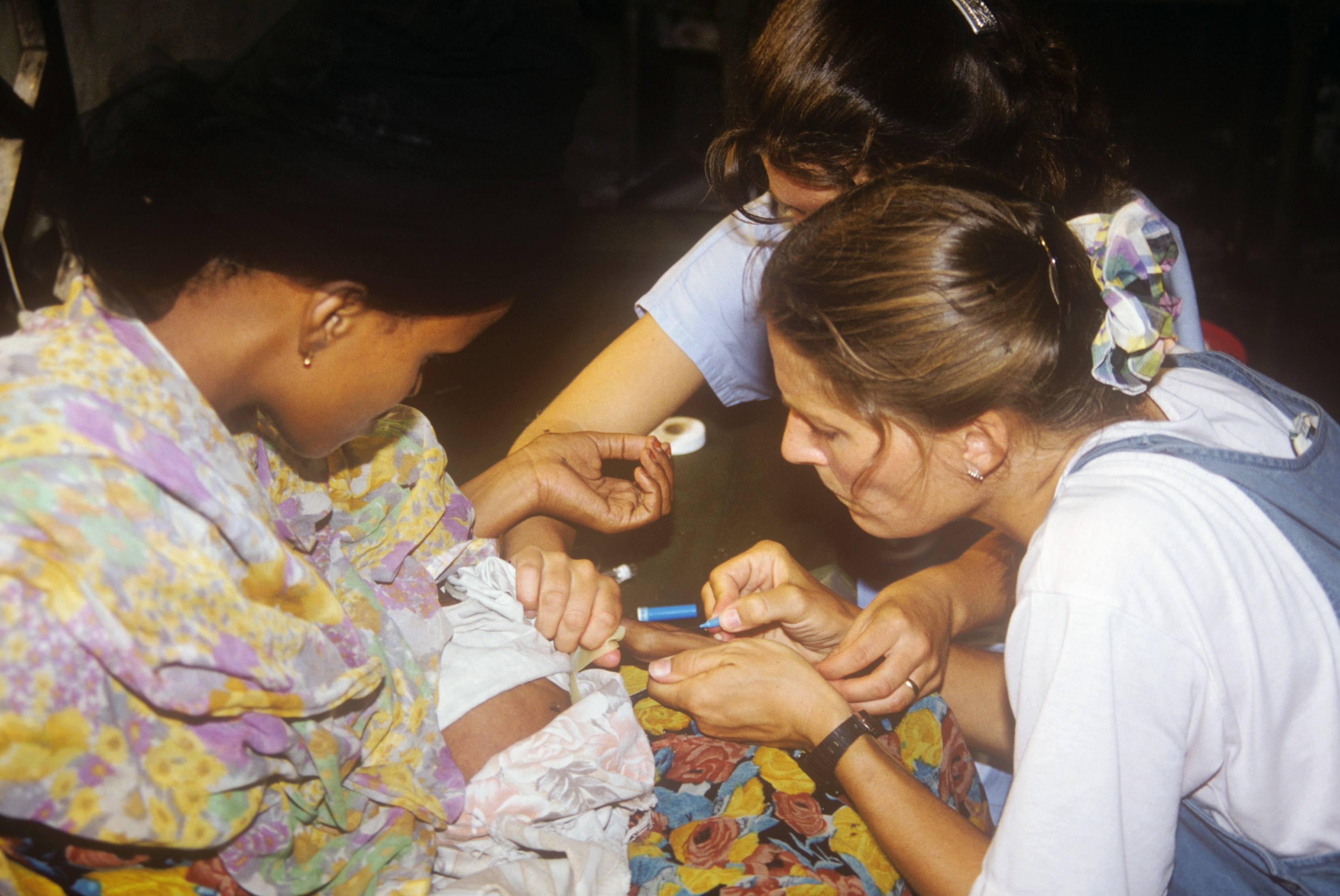 Dr. Susan Vitalis treating a baby with a medical team in Somalia