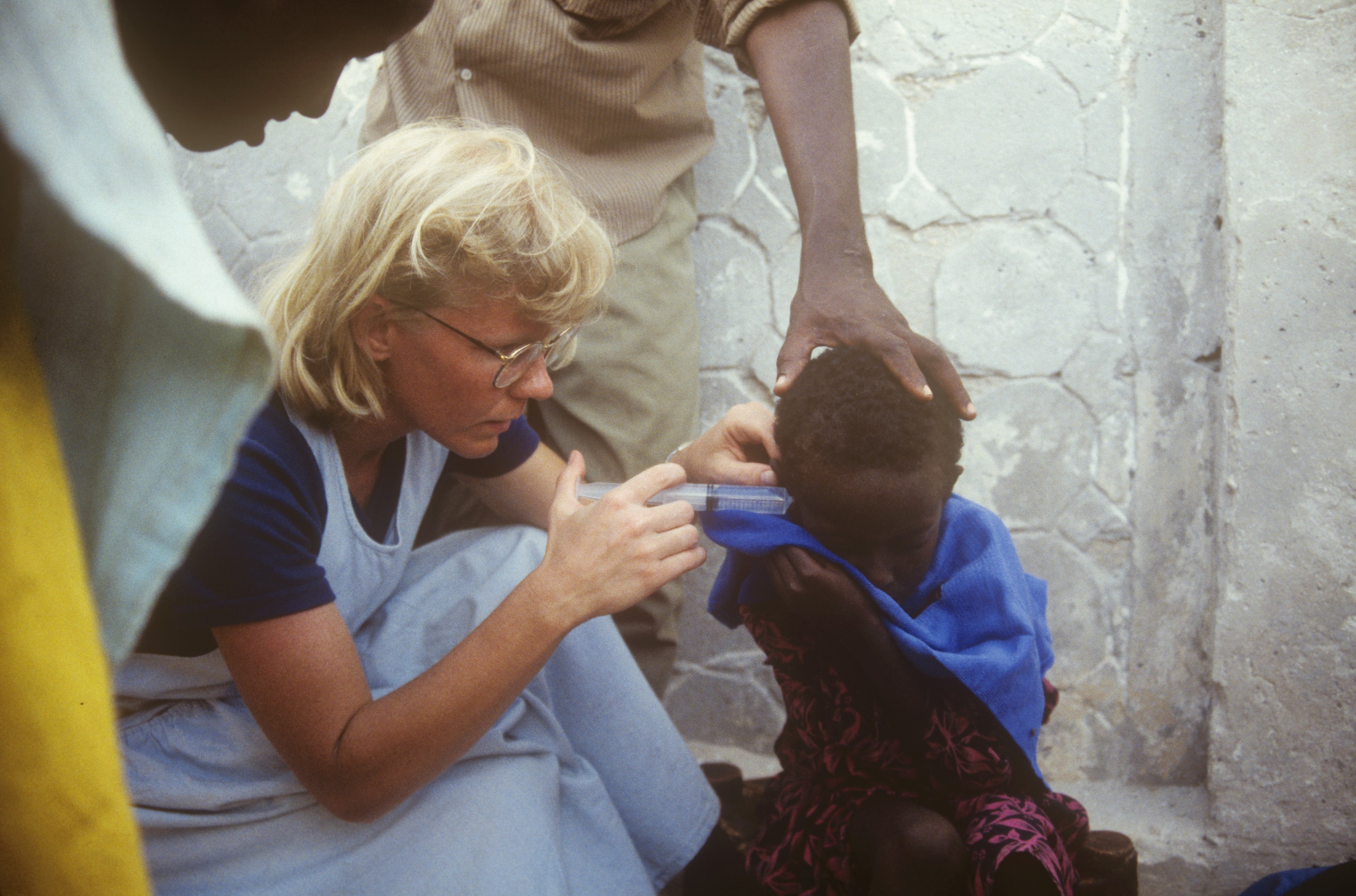 Dr. Susan Vitalis treating a child's eye at a clinic in Somalia